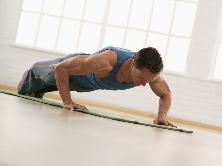 A man performs physical exercises to prevent erectile dysfunction. 